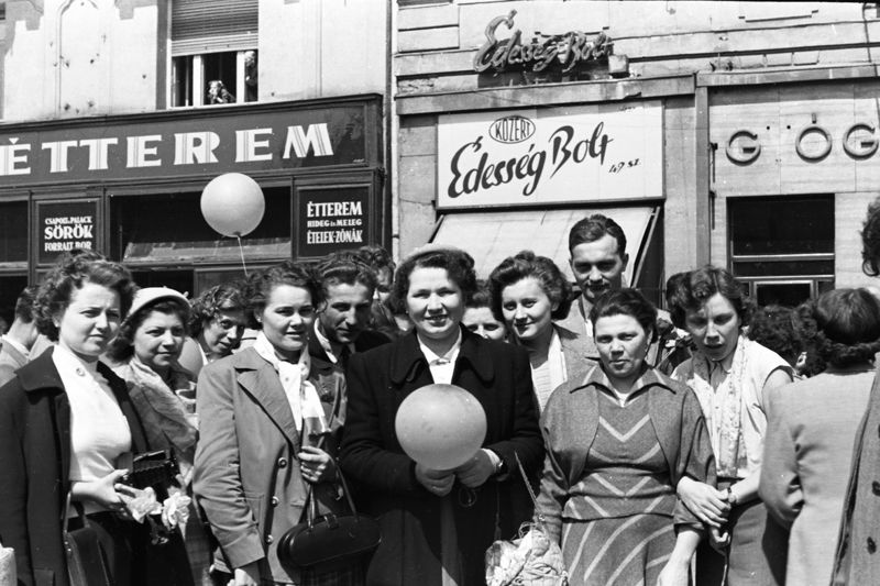 Archive photo of smiling women on a Budapest street holding balloons
